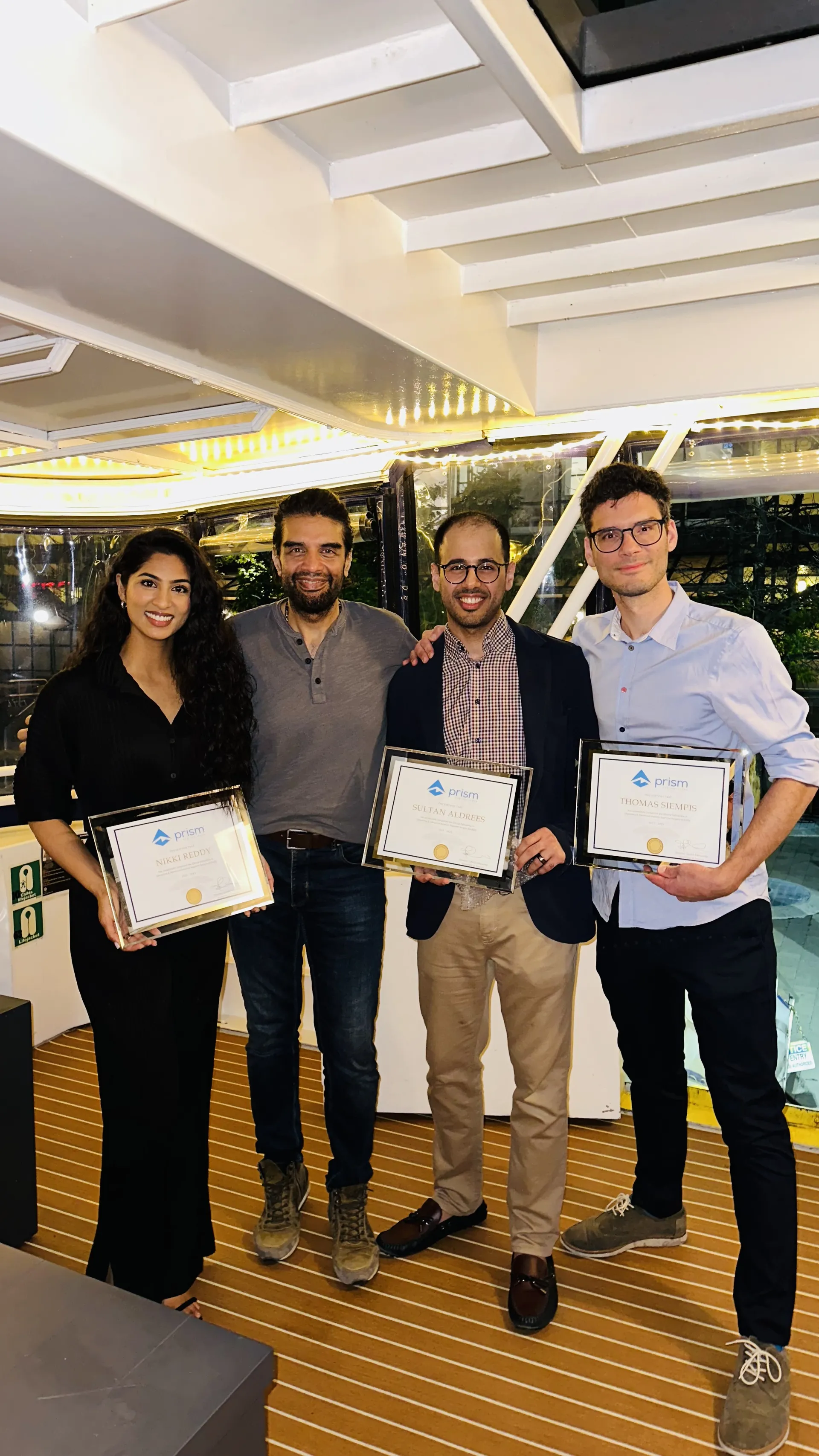 Dr. Nikitha Reddy with fellow colleagues receiving awards during fellowship training